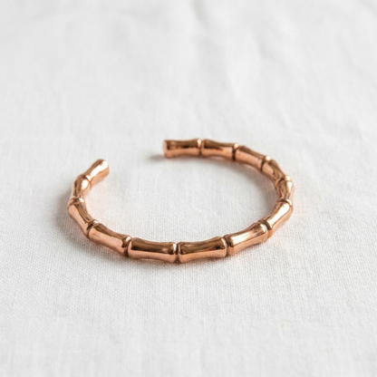 Vera's Grove Copper Bracelet on white linen background