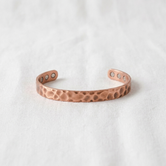 Vera's Furrow Copper Bracelet on white linen background