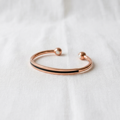 Vera's Vein Copper Bracelet on white linen background