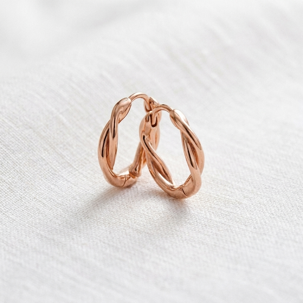 Vera's Wren Copper Hoop Earrings on white linen background