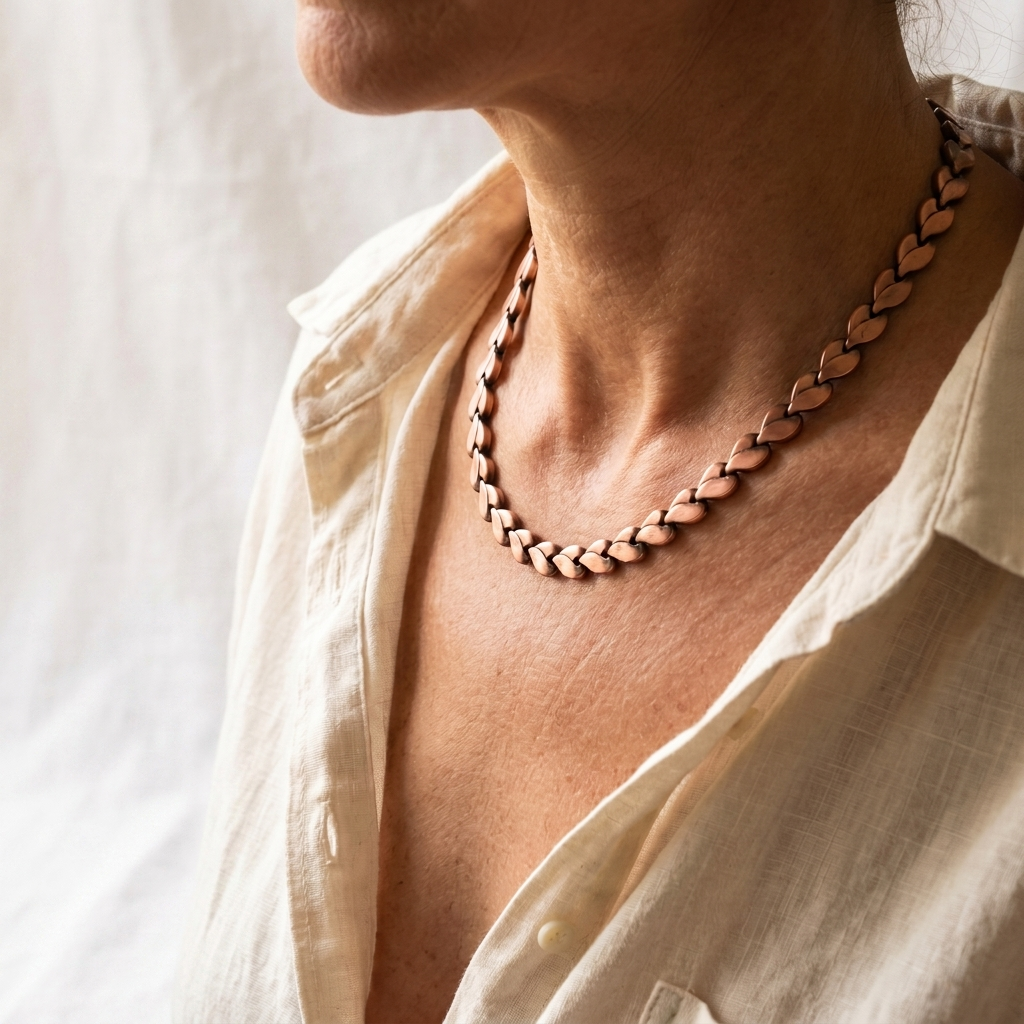 Vera's Briar Copper Necklace on white linen background