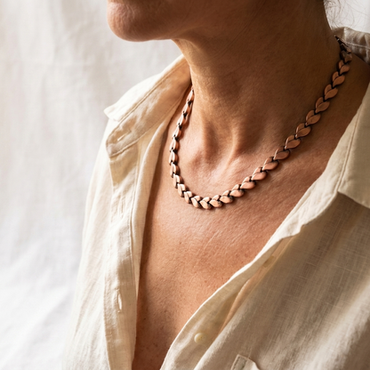 Vera's Briar Copper Necklace on white linen background