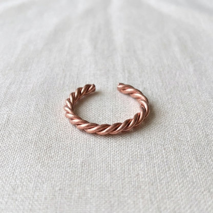 Vera's Copper Tensor Ring on white linen background