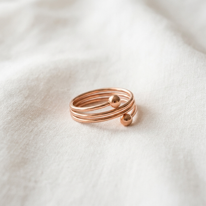 Vera's Silt Copper Ring on white linen background