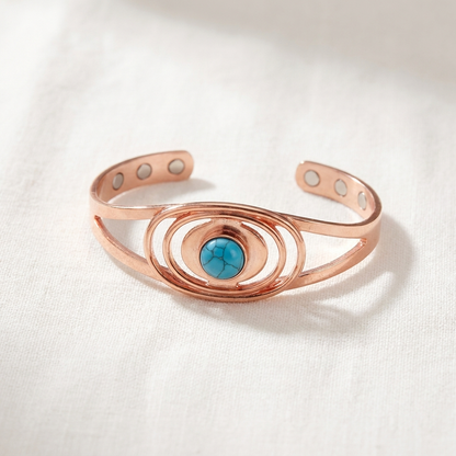 Vera's Sedge Copper Bracelet on white linen background