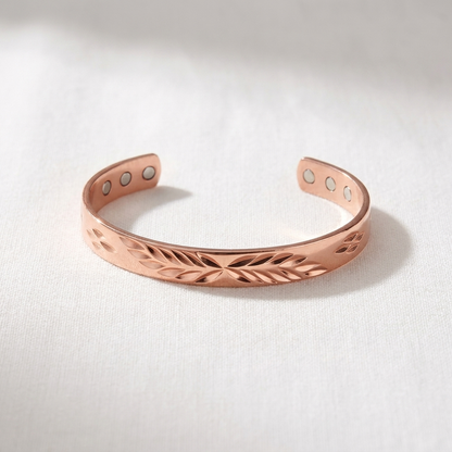 Vera's Lunar Copper Bracelet on white linen background